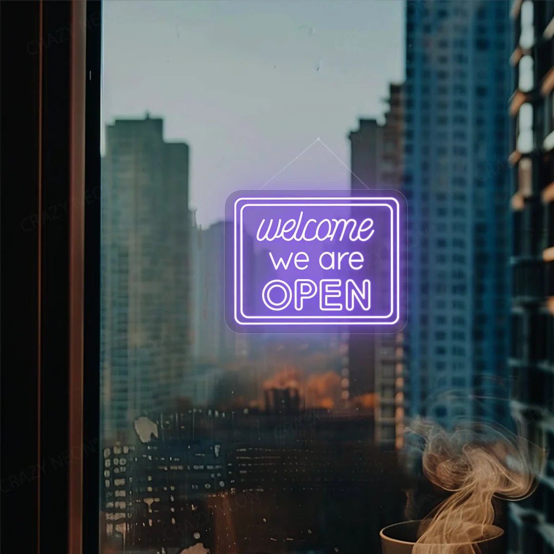 Open neon sign, Welcome LED light display. Pink and blue glow. Storefront decor. Image 11 of 16.